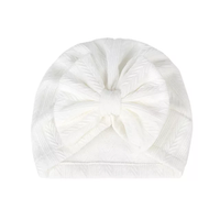 textured turban with large knot bow