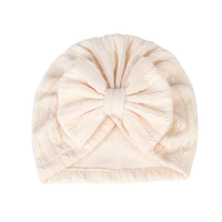 textured turban with large knot bow