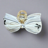 Large retro bow clutcher