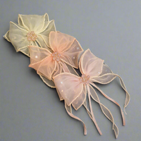 Bow fascinator hairclip with trail