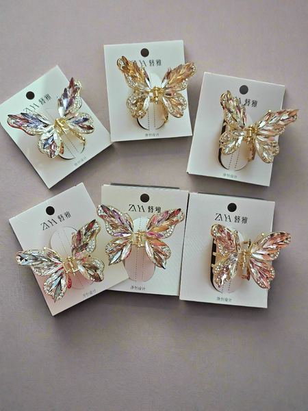 Leaf crystals and rhinestone butterfly clutcher