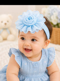 pretmybaby baby wearing a light blue chiffon flower headband with layered petals, perfect for special occasions.