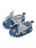 pretmybaby blue baby bellies with pink floral embroidery and a blue-and-white striped bow on a white background