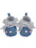 pretmybaby blue baby bellies with pink floral embroidery and a blue-and-white striped bow on a white background
