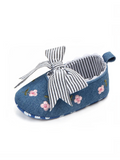 pretmybaby blue baby bellies with pink floral embroidery and a blue-and-white striped bow on a white background