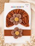 pretmybaby baby gift set featuring a brown turban cap and matching headband with large ribbed flower accents