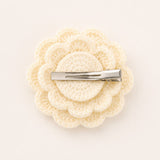 pretmybaby cream crochet rose hair clip with a sturdy metal alligator clasp on a neutral background