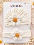 pretmybaby newborn gift set featuring a cream turban cap and matching baby headband with large white flower accents