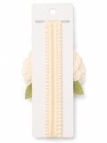 pretmybaby baby headband featuring a cream layered flower and green lace leaves on a soft ruffled elastic band