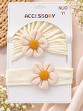 pretmybaby newborn gift set featuring a cream turban cap and matching headband with soft pink and yellow flower detail