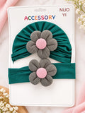 pretmybaby newborn gift set featuring a dark green turban cap and matching headband with grey and pink flower accents