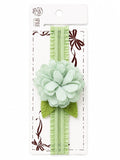 pretmybaby pastel mint green layered flower baby headband with lace leaves on a display card