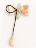 pretmybaby pastel organza tulip hairclip with a decorative bow and dangling bud on a white background