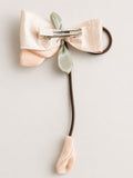pretmybaby pastel pink organza tulip hairclip with a dangling bud and bow detail on a metal alligator clip