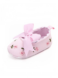 pretmybaby pink baby bellies featuring delicate floral embroidery and a striped bow on a soft fabric upper