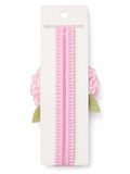 pretmybaby baby headband featuring a soft pink layered flower and delicate green lace leaves on a ruffled pink band