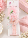 pretmybaby pastel pink baby headband with a layered rose, butterfly, feathers, and delicate crystal accents