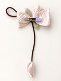 pretmybaby pastel pink organza tulip hairclip with a dangling bud and bow detail for special occasions
