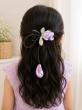 pretmybaby hairclip featuring a pastel purple organza tulip flower on a bow with a delicate dangling bud