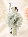 pretmybaby baby headband featuring a large layered sage green fluffy flower on a soft elastic band for infants