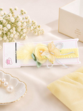 pretmybaby pastel yellow baby headband with a layered rose, butterfly, feathers, and beaded accents for special events
