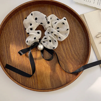 Retro black and white scrunchie with pearl and ribbon bow