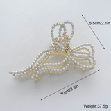 Large assymetric pearls bow clutcher clip