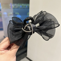 Large bow and rose clutcher