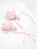 Pair of satin tulip bud fascinator hairclips with ribbon trails