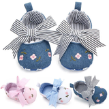 Pret My Baby Embroidery Bellies with Stripe Bow - Blue feature a denim blue design, floral embroidery, large striped bows, a soft striped lining, and non-slip soles for safety.