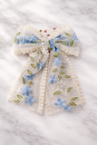Lace bow with colourful embroidery