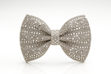 The Pretmebabe Midnight Sparkle Luxe Bow, Style 4, features geometric patterns with sparkling white diamonds, creating a stunning statement brooch against a plain white background.
