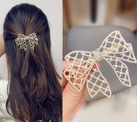 Evening metal bow buckle with pearls