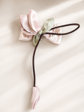 Fascinator tulip on bow with dangling bud