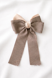 The pretmebabe Checkered Bow with trail Hair Clip features a brown and white houndstooth pattern with a pale beige center, adding classic glamour to any look.
