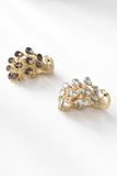 Two peacock-shaped brooches—one with dark gemstones, the other with iridescent stones—make striking hair accents. Pair them with the Pretmebabe Peacock ponytail clutcher for a chic, elevated look.