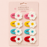 Set of 8 pretmybaby Crochet flower tic tac clips—4 pairs with white flowers and colored centers, on sturdy pink, yellow, teal, and red clips. Displayed on a pink card labeled “Crochet Hair Clips.”.