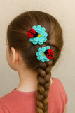 Pair of Crochet ladybug on flowers hairclip