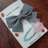 Checks bow and matching tictac clip