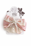 The Pret my baby Multiple bow with doiley lace fascinator hairclip features pink and cream satin bows, pearl center, and lace trim on an alligator pin. Displayed on a STYLE SEOUL card with floral and bow accents.