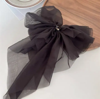 Fluffy volume bow in gossamer fabric
