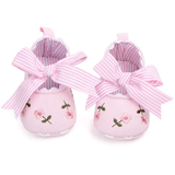 Pret my baby Embroidery bellies with stripe bow - pink: Adorable pink baby shoes featuring floral embroidery, large pink-and-white striped bows, scalloped edges, a soft striped lining, and non-slip soles for safety.