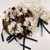 Retro black and white scrunchie with pearl and ribbon bow