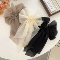 Fluffy volume bow in gossamer fabric