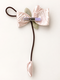 Fascinator tulip on bow with dangling bud