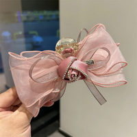 Large bow and rose clutcher