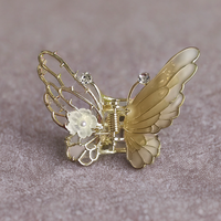 Small enamel butterfly clutcher