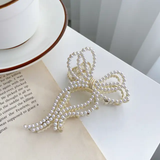 Large assymetric pearls bow clutcher clip
