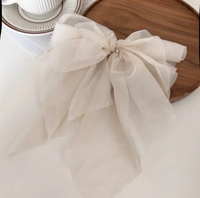 Fluffy volume bow in gossamer fabric