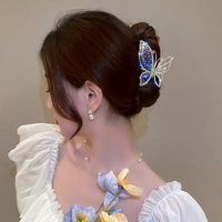 rhynestone lined flying butterfly medium metal clutcher
